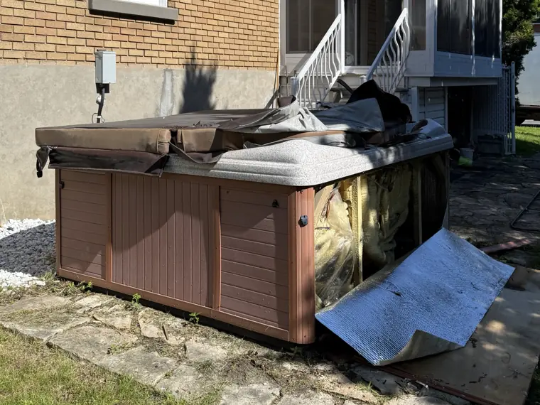 Spa in a yard before its removal